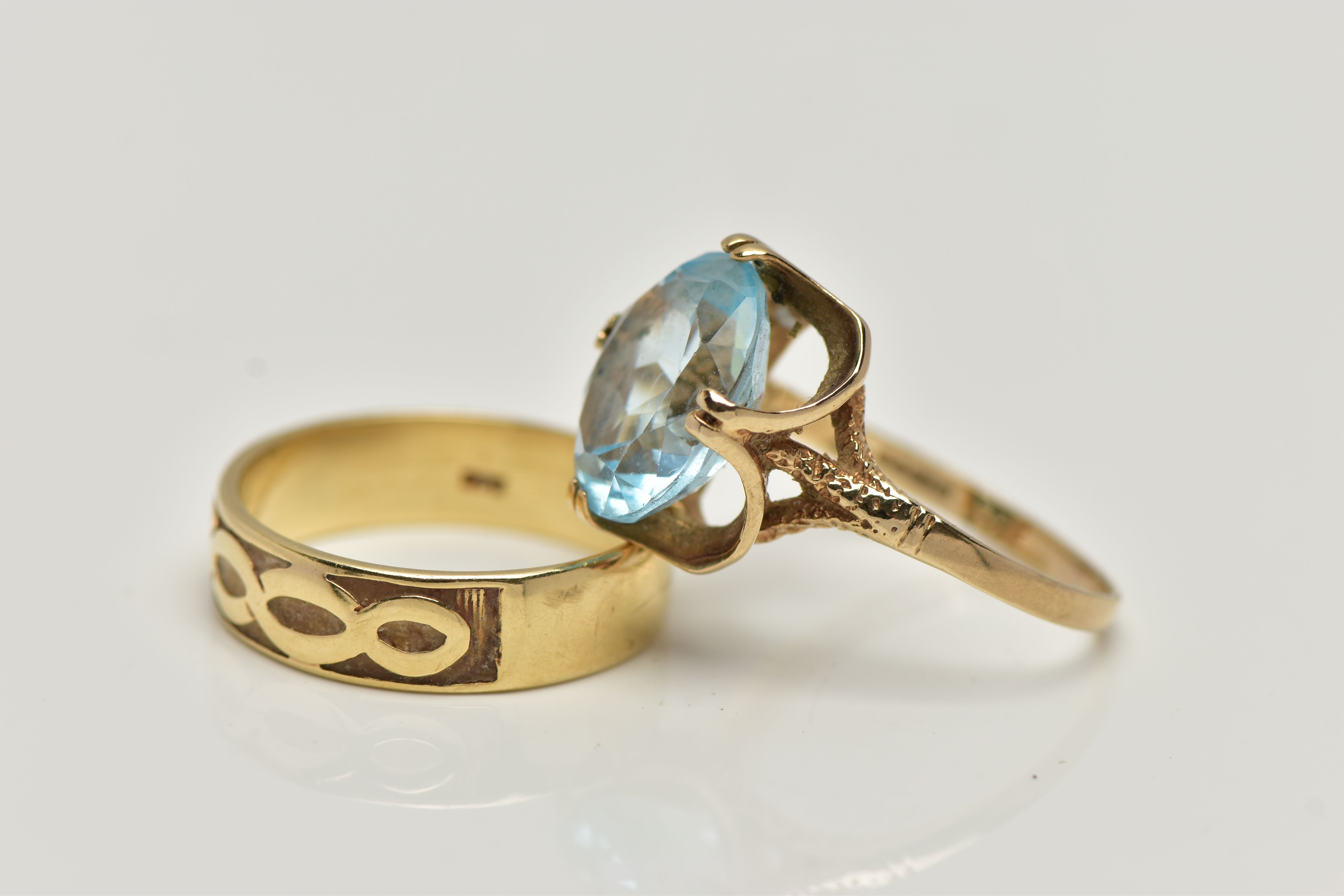 TWO 9CT GOLD RINGS, the first designed with a double four claw set, oval cut light blue topaz, in an - Image 3 of 4