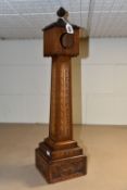 A CARVED WOODEN CLOCK/ POCKET WATCH CASE IN THE FORM OF A CLOCK TOWER, dated 1893 to the base,