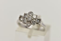AN 18CT WHITE GOLD DIAMOND CLUSTER RING, of a marquise outline, set with nine round brilliant cut