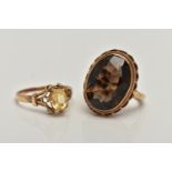 TWO GEMSTONE SET RINGS, the first a large oval smoky quartz, measuring approximately length 18.7mm x