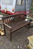 A PAINTED WEATHERED TEAK GARDEN BENCH, length 150cm