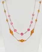 TWO PASTE SET NECKLACES, the first set with faceted pink paste interspaced with colourless paste,