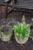 TWO CIRCULAR WEATHERED COMPOSITE PLANTERS, one with shells and the other with as brick effect,