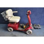 A ELECTRA MOTION MOBILITY SCOOTER with charger but missing battery (UNTESTED) along with a GoGo