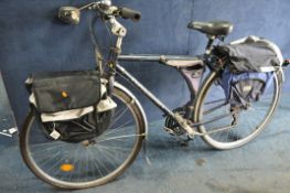 A VINTAGE RALEIGH BICYCLE model unknown comes with front and rear metal racks and two new saddle