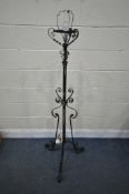 AN ARTS AND CRAFTS WROUGHT IRON TELESCOPIC CONVERTED OIL LAMP, height minus light fitting 151cm (