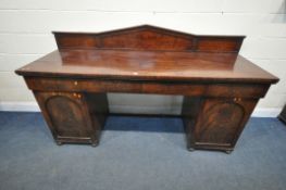 A VICTORIAN MAHOGANY TWIN PEDESTAL SIDEBOARD, with a shaped raised back, three drawers, above two