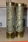 A PAIR OF TRENCH ART SHELL CASES, both decorated with the matching stylised floral design (2)