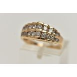 A 14CT GOLD DIAMOND RING, designed as two rows of graduating round brilliant cut diamonds, in a
