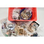 A RED PLASTIC BOX OF ASSORTED COSTUME JEWELLERY AND ITEMS, to include various beaded necklaces,