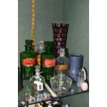 A GROUP OF CHEMISTS BOTTLES AND OTHER GLASS WARES, comprising four labelled chemists bottles - two