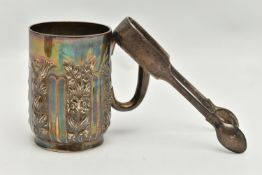 A LATE VICTORIAN SILVER MUG AND A PAIR OF VICTORIAN FIDDLE PATTERN SUGAR TONGS, the mug repoussé
