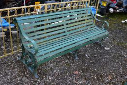 A GREEN PAINTED STRAPWORK IRON BENCH, with scrolled arms and supports, length 184cm (condition:-
