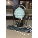 A FRENCH ART DECO SQUIRREL LAMP, with original mottled green glass shade and chrome frame,