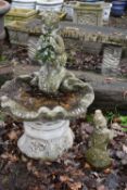 A WEATHERED COMPOSITE SHELL SHAPED BIRD BATH, with a mythical creature playing an instrument, height