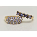 TWO 9CT GOLD TANZANITE RINGS, the first designed with a row of three circular cut tanzanite, sixteen