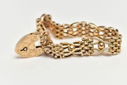 A 15CT YELLOW GOLD, WIDE GATE BRACELET, featuring textured oval links and ball detail, fitted with a