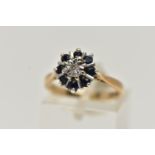 A 9CT GOLD SAPPHIRE AND DIAMOND CLUSTER RING, centring on a single cut diamond illusion set, in a