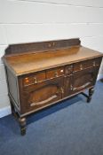 AN EARLY 20TH CENTURY OAK SIDEBOARD, with a raised back, two drawers and double panel cupboard