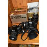 TWO CAMERAS AND LENSES, comprising a boxed Nikon F-301 camera with a Nikon Nikkor 50mm 1:1.8 lens,