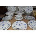 A THIRTY TWO PIECE L BERNARDAUD LIMOGES DINNER SERVICE, decorated with sprays of blue flowers,