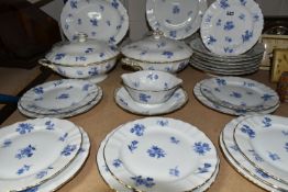A THIRTY TWO PIECE L BERNARDAUD LIMOGES DINNER SERVICE, decorated with sprays of blue flowers,