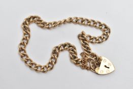 A 9CT GOLD CURB LINK BRACELET, polished curb link bracelet, fitted with a heart padlock clasp with