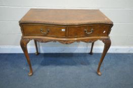 A REPRODUCTION QUEEN ANNE STYLE WALNUT SERPENTINE SIDE TABLE, with two drawers, on cabriole legs,