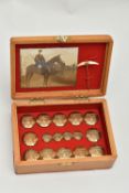 A SMALL BOXED SET OF HUNTING BUTTONS, to include twelve larger brass buttons and four smaller
