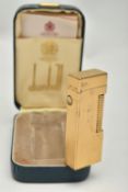 A CASED DUNHILL ROLLAGAS LIGHTER, of gold plated, engine turned design, stamped Made In Switzerland,