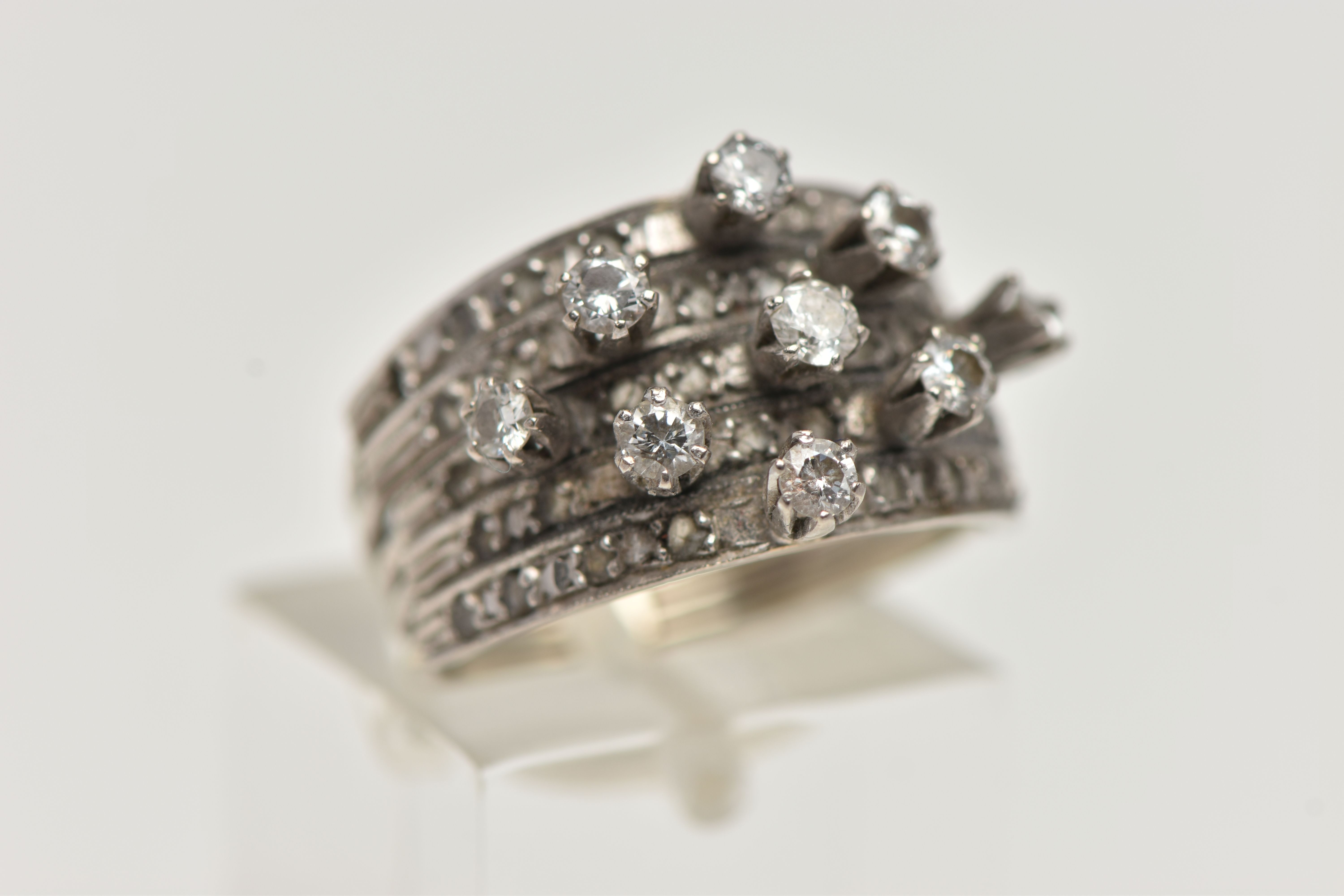 A WHITE METAL DIAMOND RING, comprising of five individual bands fitted together with a band - Image 4 of 5