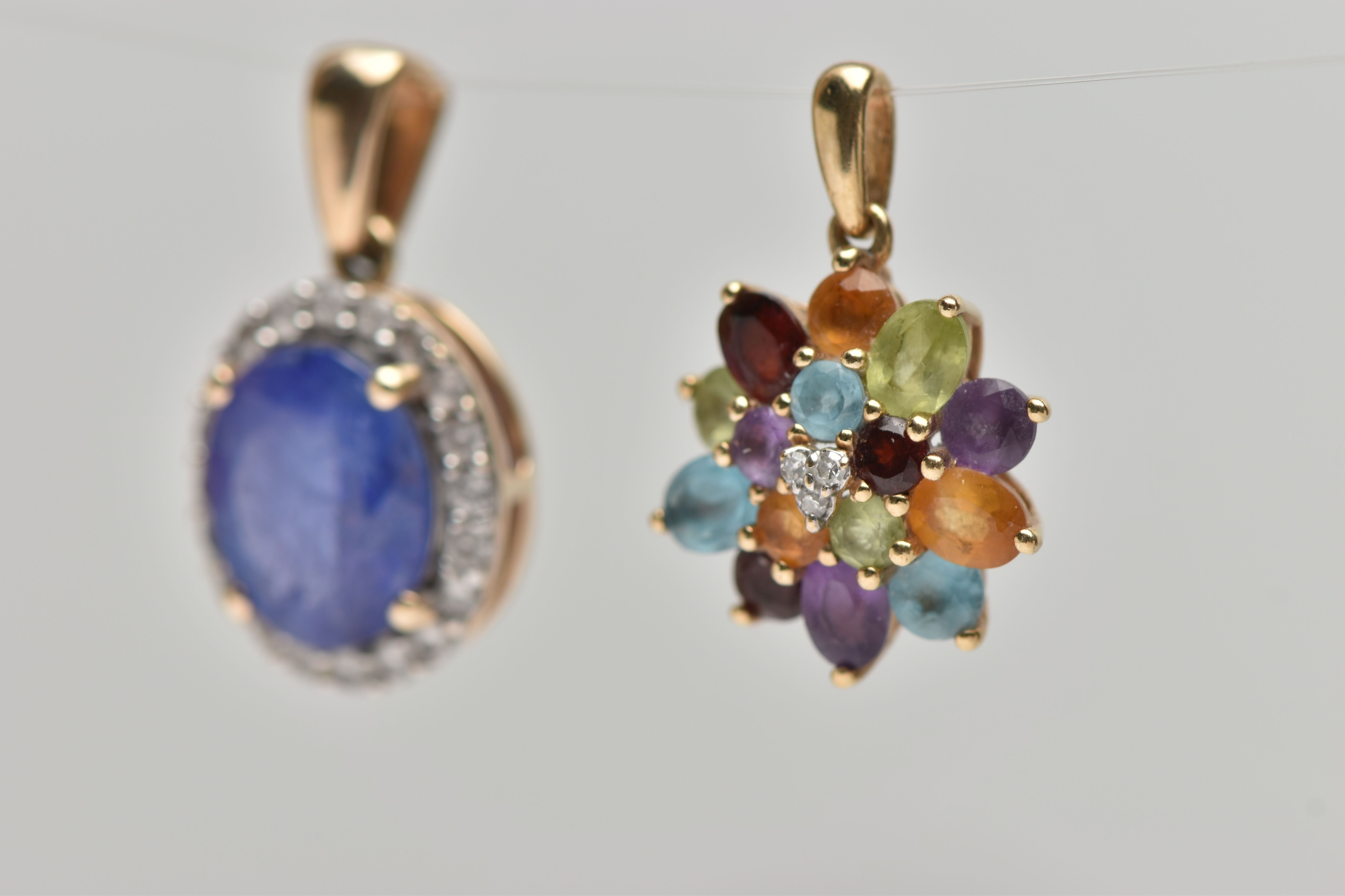 TWO 9CT GOLD GEM SET PENDANTS, the first an oval cluster designed with a four claw set oval cut - Image 3 of 4