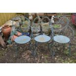 A SET OF THREE METAL GARDEN CHAIRS with circular seats and scrolled back and legs (3)