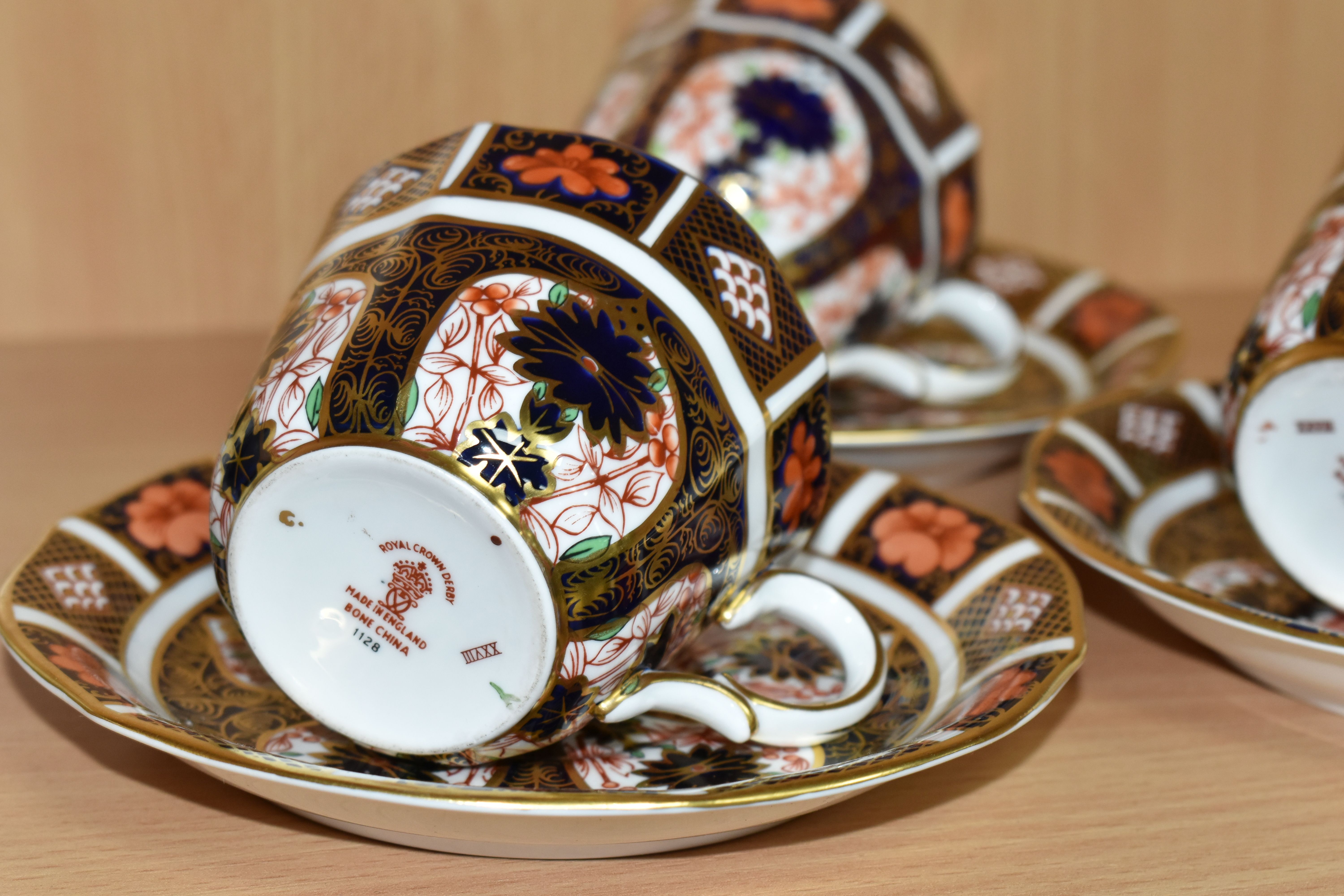 THREE ROYAL CROWN DERBY IMARI 1128 TEACUPS AND SAUCERS, having red printed backstamps, most pieces - Image 2 of 4