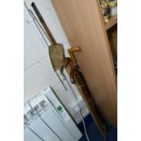 A GROUP OF VICTORIAN WALKING STICKS, comprising a hand forged golf club, vintage cane fishing rod,