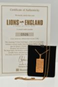 A 9CT GOLD INGOT PENDANT WITH CHAIN, the rectangular 'Lions of England' ingot, hallmarked 9ct