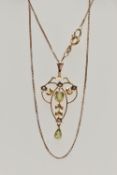A YELLOW METAL LAVALIER PENDANT AND CHAIN, openwork pendant set with a central oval cut peridot with