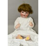 A SCHOENAU & HOFFMEISTER BISQUE HEAD DOLL, jointed composite body, blue rolling eyes, open mouth