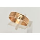 A POLISHED WIDE BAND RING, worn engraved detail to the band, approximate band width 4.8mm, stamped