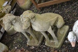 A PAIR OF MODERN COMPOSITE GARDEN FIGURES in the form of seated dogs very similar poses height 70cm