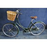A PASHLEY SOVERIEGN LADIES BICYCLE with wicker front basket, leather brooks seat/saddle, rear
