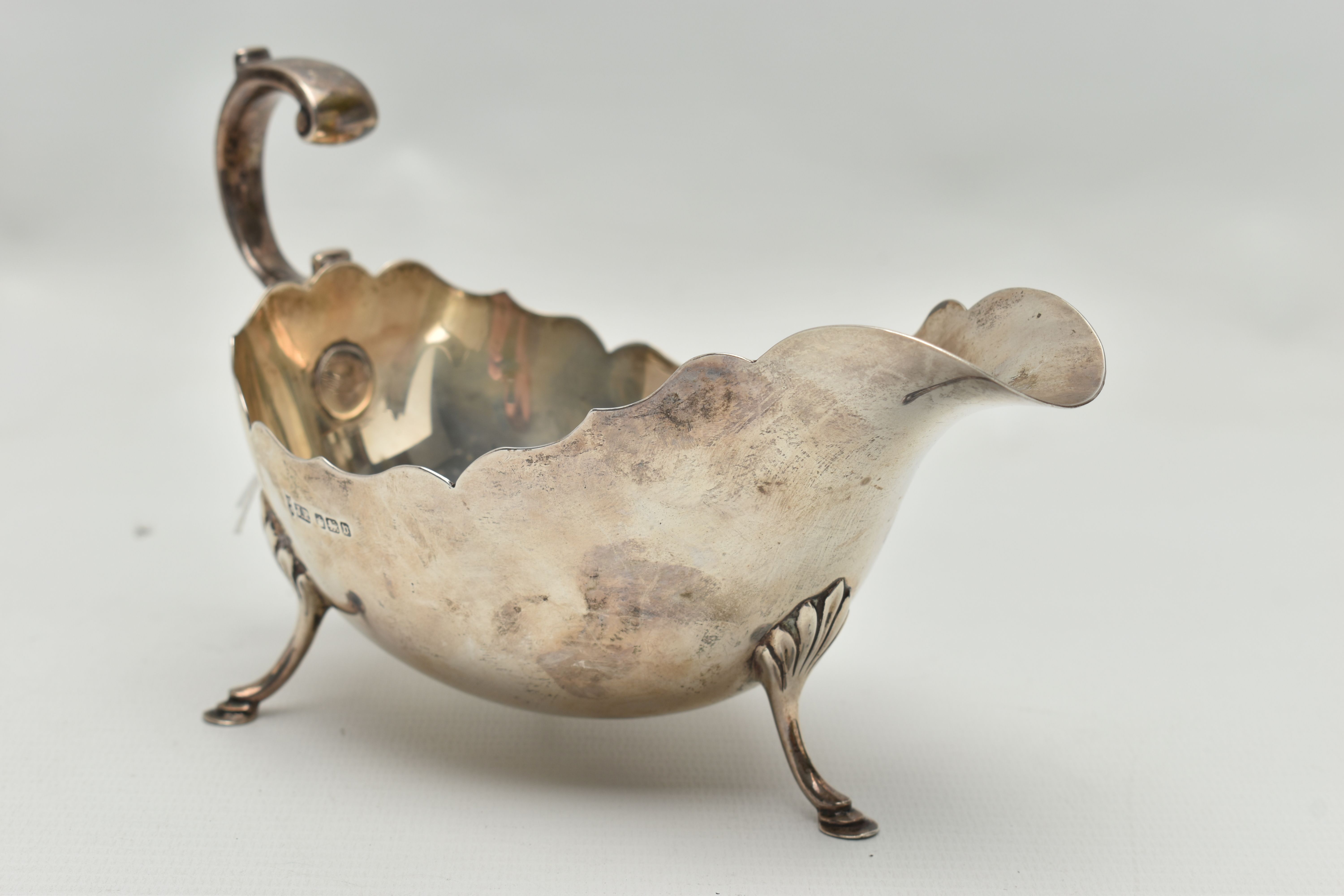 A GEORGE V SILVER SAUCE BOAT WITH WAVY RIM, 'S' scroll handle, on three cabriole legs with shell - Image 2 of 6