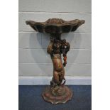 AN ITALIAN GARDEN SCHULPTURE/BIRD BATH, of a cherub holding a shell aloft, height 101cm