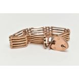 A ROSE METAL BRACELET WITH PADLOCK CLASP, five bar bracelet, some polished and some textured bars,