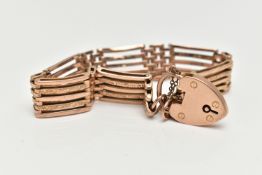 A ROSE METAL BRACELET WITH PADLOCK CLASP, five bar bracelet, some polished and some textured bars,