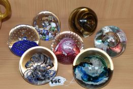 SEVEN GLASS PAPERWEIGHTS, to include Selkirk Glass Wave Tide 1999, a Selkirk Glass blue, black and