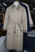 LADIES' AQUASCUTUM SHOWERPROOF COATS, to include two quilted showerproof full length coats, one navy