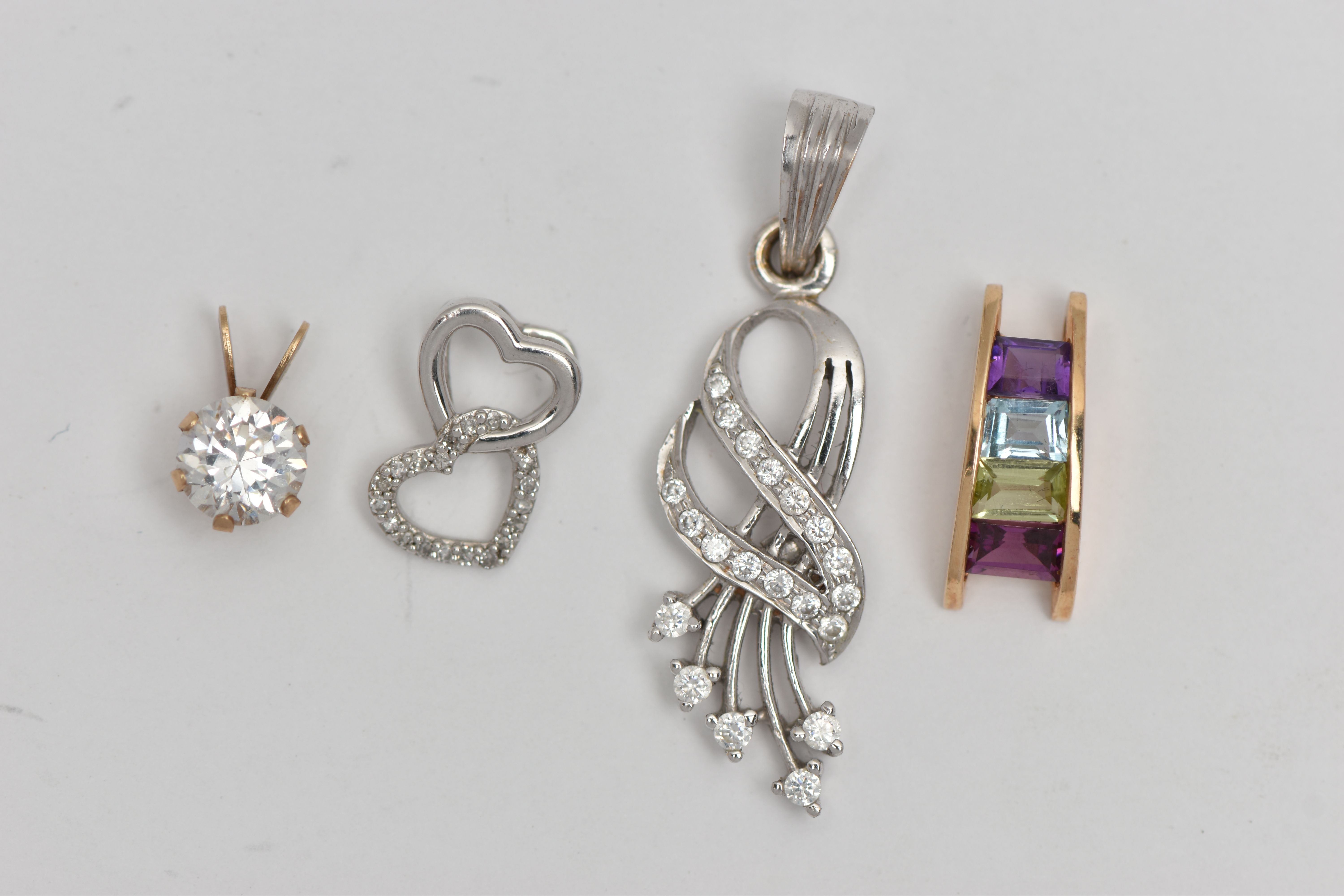FOUR PENDANTS, to include a yellow metal curved pendant set with peridot, amethyst, topaz,