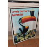 A REPRODUCTION GUINNESS ADVERTISING POSTER, box canvas, published by Pyramid Posters, approximate