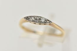 A YELLOW METAL DIAMOND BOAT RING, set with three graduated old cut diamonds and two rose cut